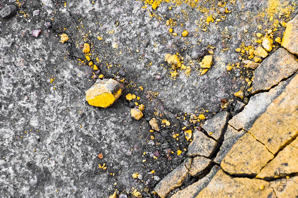 friable, yellow paint on road surface