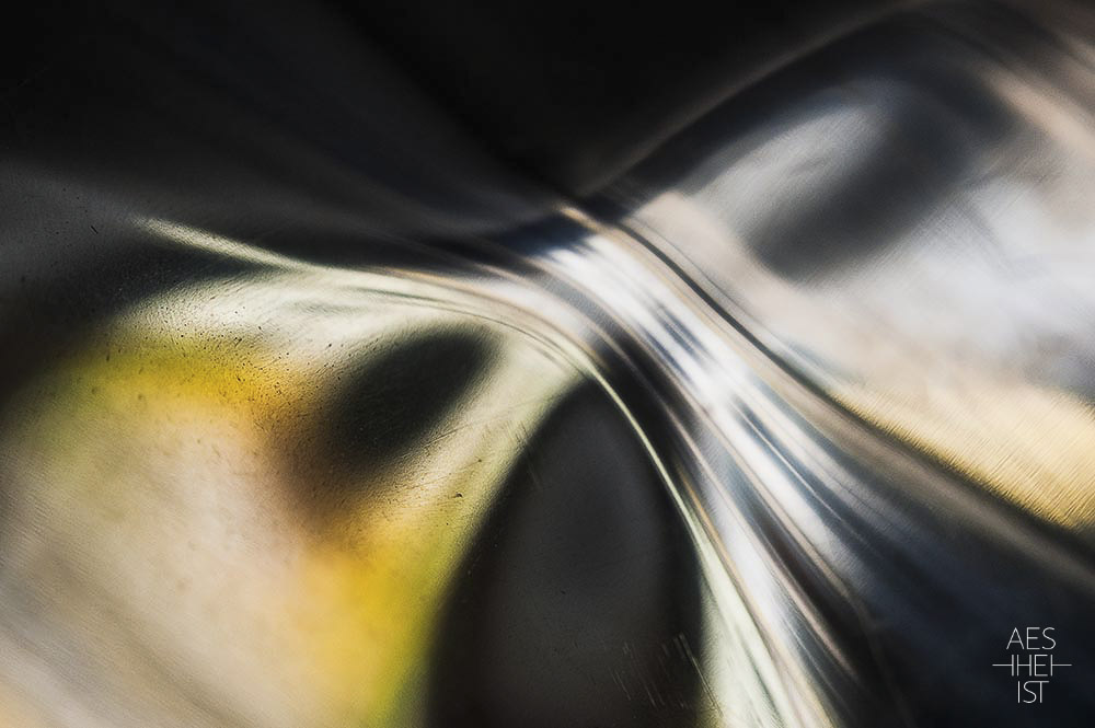 abstract light- and colorplay on metal