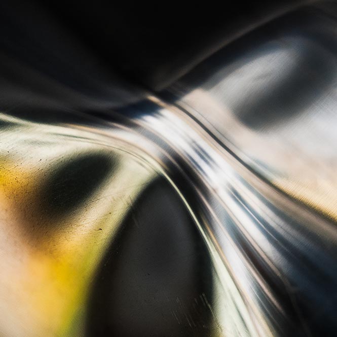 abstract light- and colorplay on metal