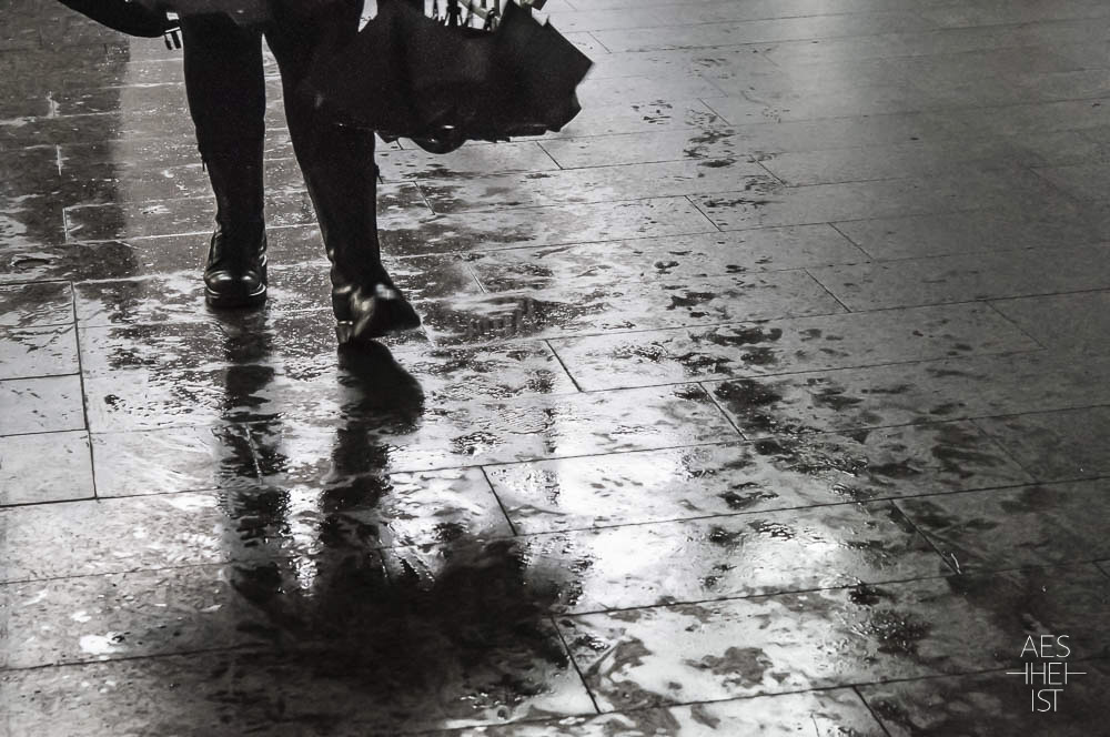 legs mirrored on wet ground