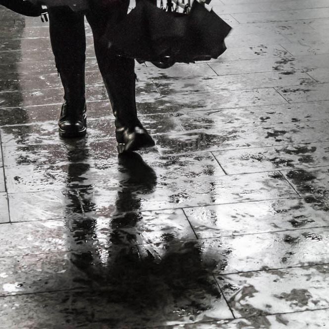 legs mirrored on wet ground