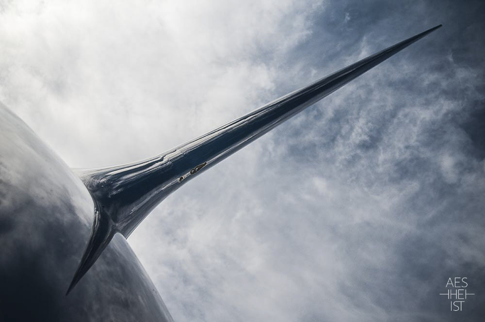 metallic needle rising up to cloudy sky