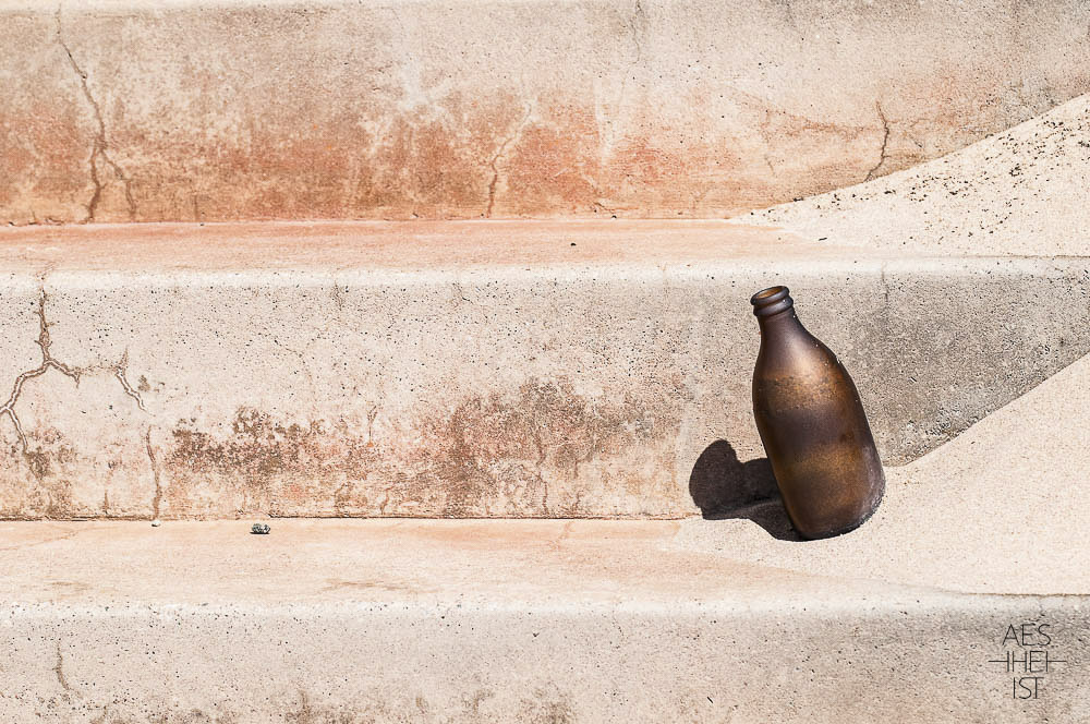 sand blasted bottle on a stair